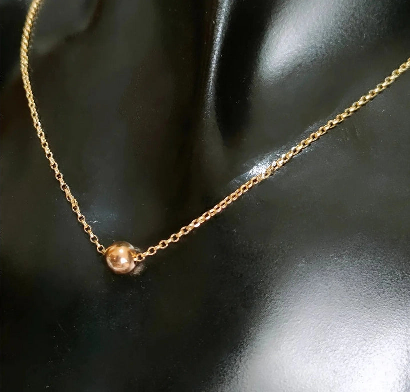 Collier avec une boule et chaine chopard en Or 18 carats