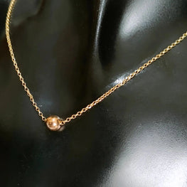 Collier avec une boule et chaine chopard en Or 18 carats